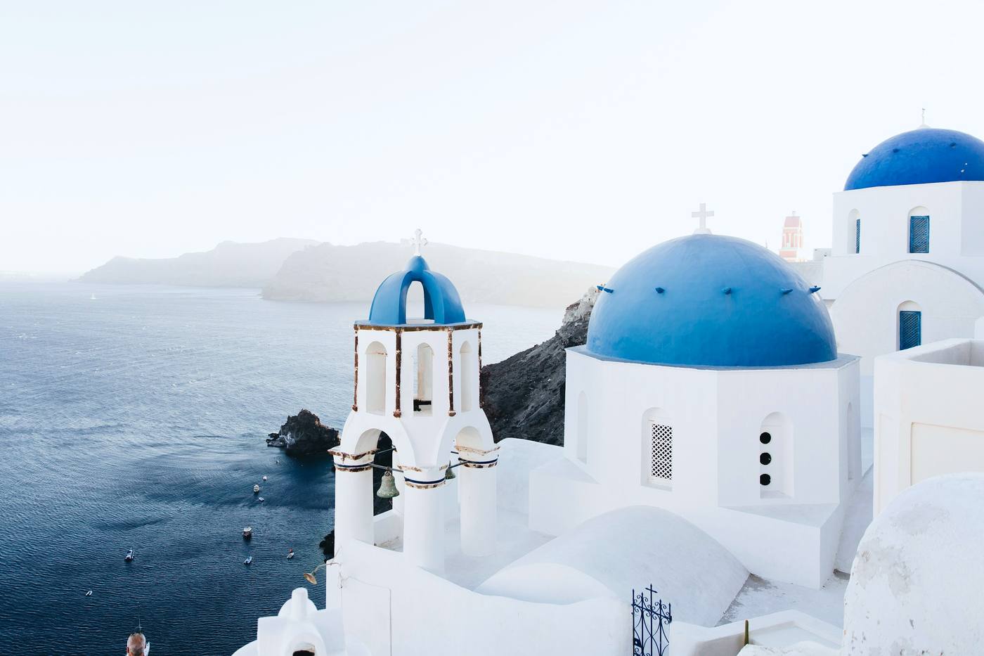 Blue-domed churches above the sea in Santorini, Greece