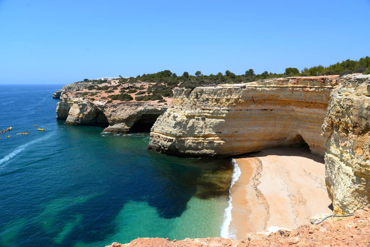 Golden cliffs above a secluded beach on the Algarve coast, Portugal